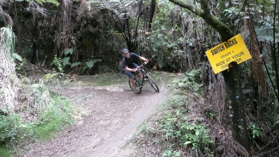 Andy rails the switchback track at Oropi Grove